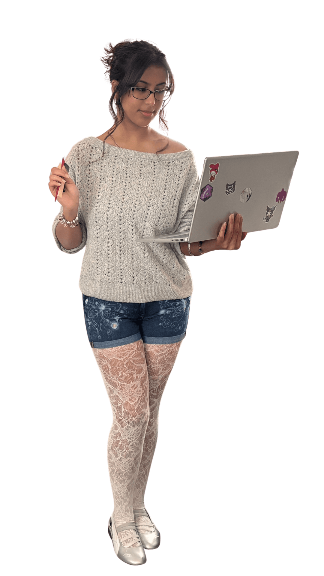 arjita standing with her sticker-covered laptop in hand